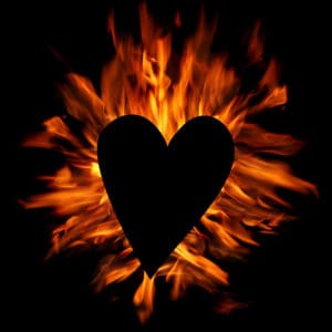 Black heart with ornage flames